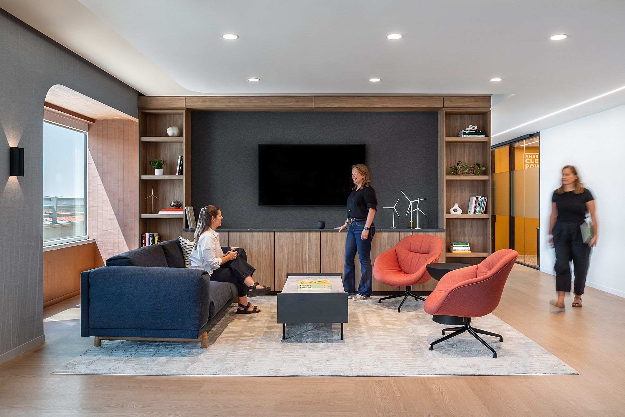 image of three people in a casual meeting area
