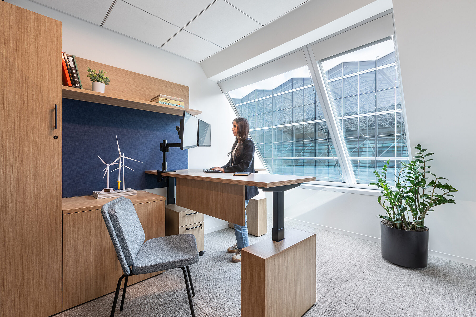 image of a woman at a sit to stand desk