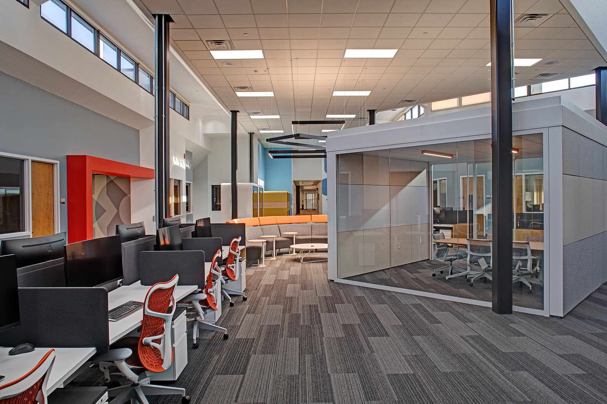 interior image of workstations and meeting room