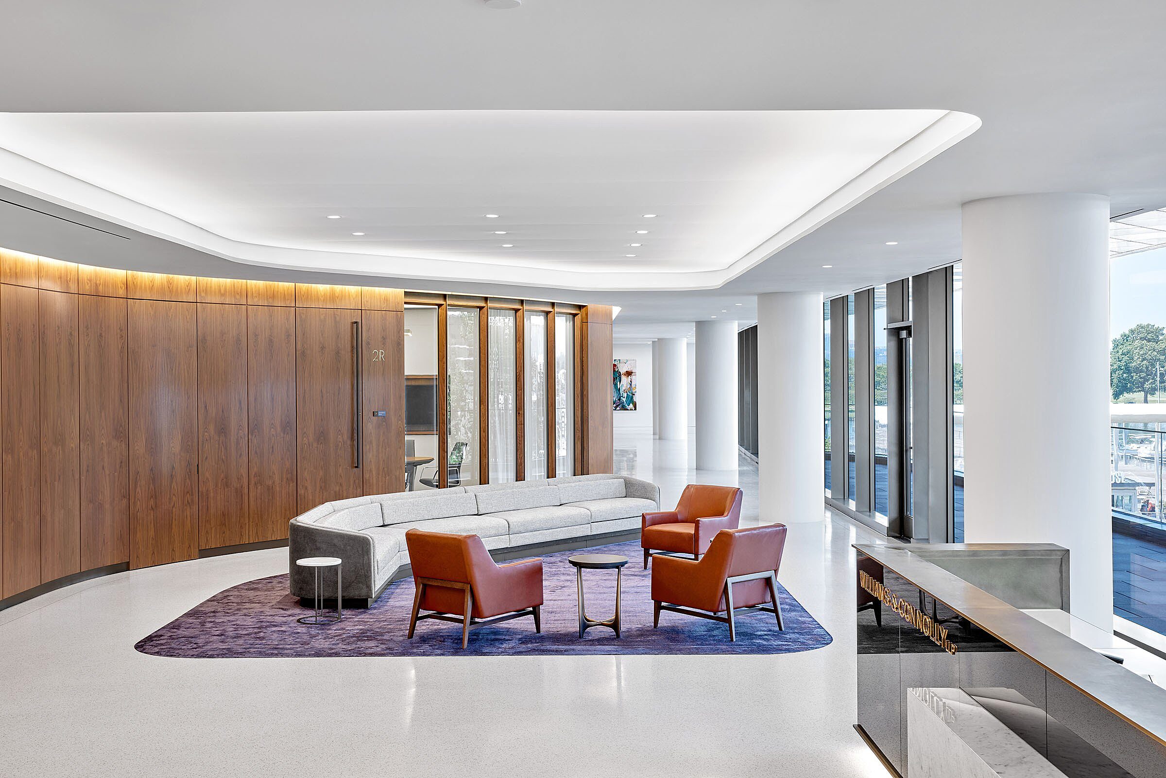 Open office workspace reception seating area with natural light