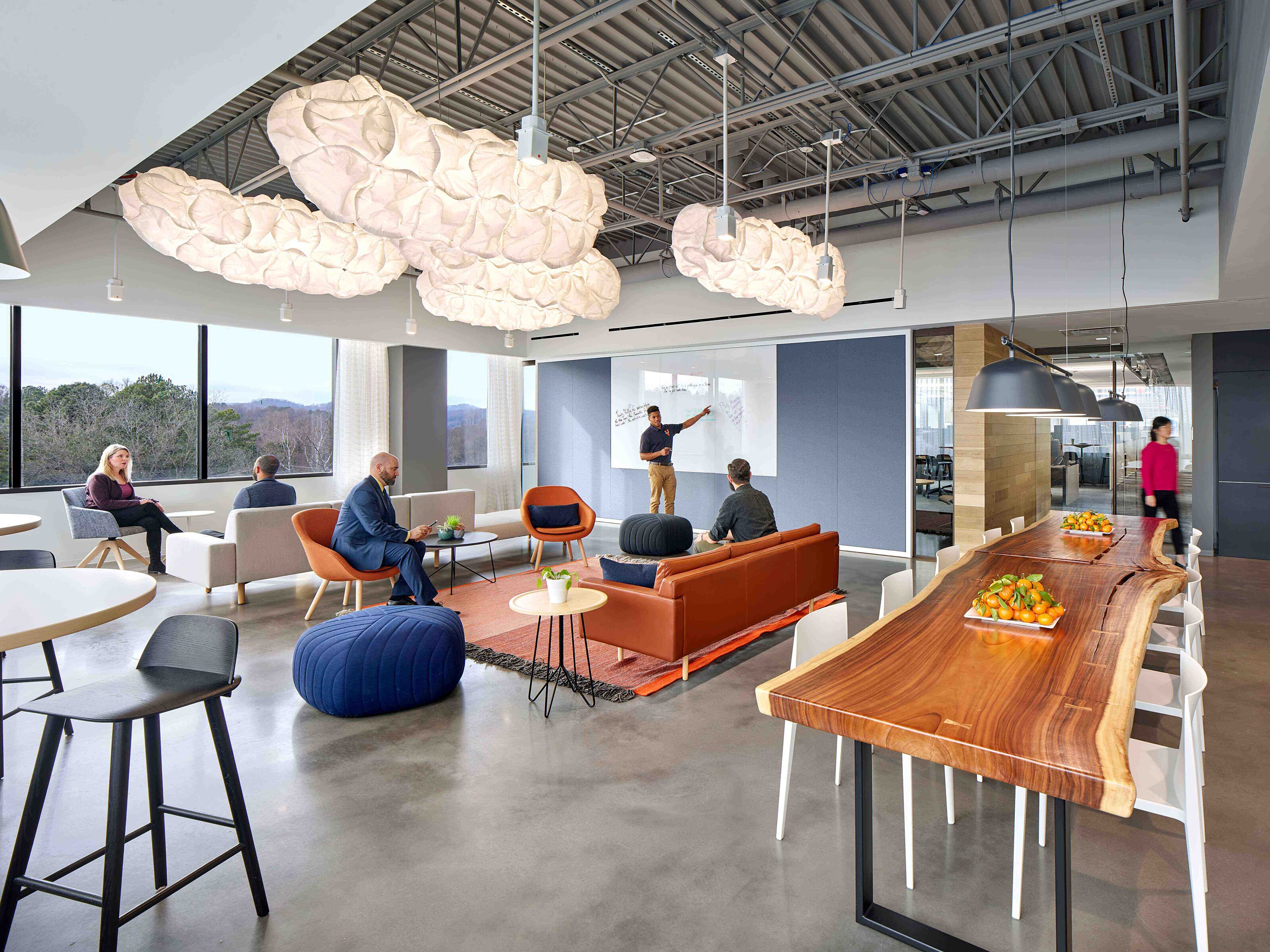 Bright and modern multipurpose room with team engaging